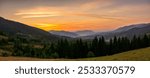 panorama of countryside mountain landscape of ukraine in autumn at dawn. rural fields on forested hills. nice scenery of carpathian mountains in fall season