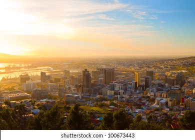 Panorama - Dawn in Cape Town (South Africa), the city center with mountains in the morning haze