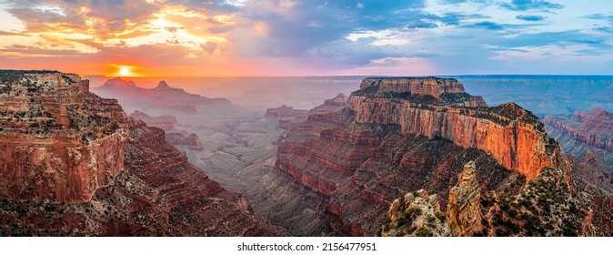 Panorama of the dawn over the red canyon. Red rock canyon at dawn. Canyon at dawn panorama. Panoramic landscape of canyon at dawn - Shutterstock ID 2156477951