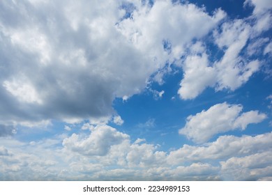 Panorama of daytime sky with clouds. Sky background, daylight sky with lighted clouds. Beauty clouds over sea - Shutterstock ID 2234989153