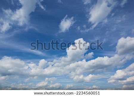 Panorama of daytime sky with clouds. Sky background, daylight sky with lighted clouds. Beauty clouds over sea