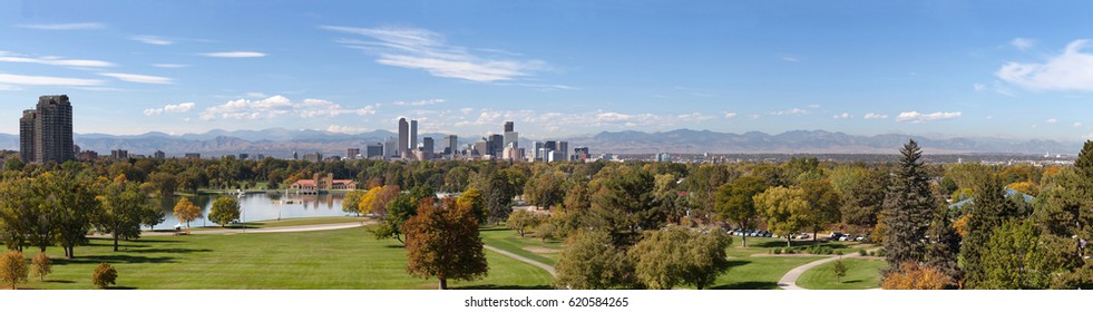 Panorama of Denver City Park with skylines and rocky mountains in the background.