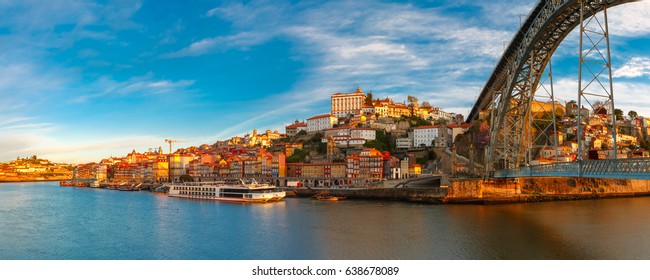 Panorama of Douro river, Ribeira and Dom Luis I or Luiz I iron bridge in the sunny morning Porto, Portugal.