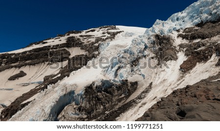 A Panorama of Dramatic Ice and Rock Cliffs at Camp Hazard. Kautz Glacier, Mt Rainier National Park, Washington