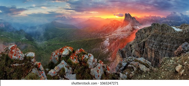 Panorama dramatic sunset in dolomites alp mountain from peak Nuvolau