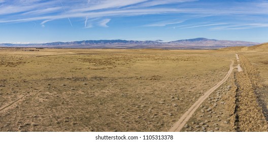 Panorama of dry desert plain during the California drought in central plain.