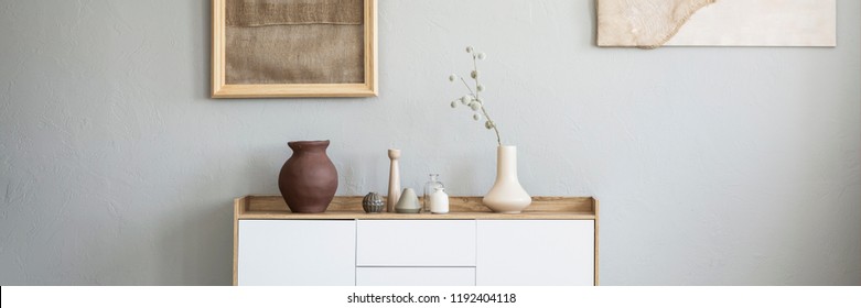 Panorama Of Earth Tone Color, Clay And Ceramic Vases On A Wooden, White Cabinet In A Natural Living Room Interior