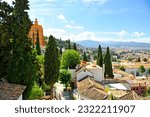 Panorama of El Realejo quarter in Granada with Sierra Nevada in the background. Granada is one of the most visited cities in Andalusia and Spain.