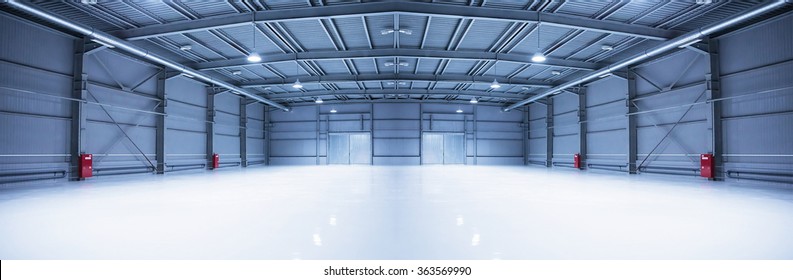 Panorama of empty room of modern storehouse with gates