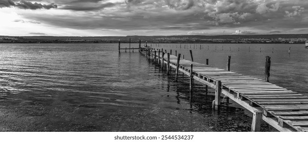 Panorama of exciting clouds at the sky and a wooden pier  - Powered by Shutterstock