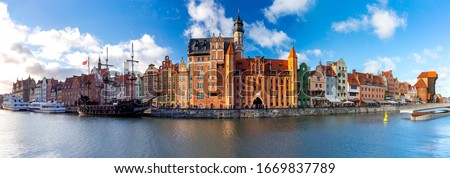 Panorama of the facades of old medieval houses on the promenade in Gdansk. Poland.