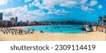 Panorama of the famous Las Canteras beach in the summertime, with tourists enjoying the summer holiday in Gran Canaria