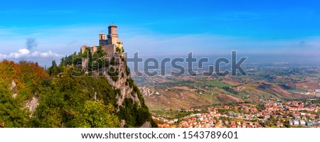 Panorama of First tower Guaita fortress in the city of San Marino of the Republic of San Marino and italian hills in sunny day