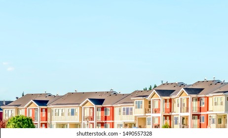 Panorama frame Blue sky on a sunny day over townhomes with white and red exterior wall
