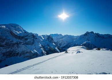 Panorama of French alps mountain tops in Savoie region on sunny day at winter