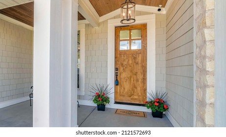 Panorama Front porch exterior of a house with decorated concrete block siding - Shutterstock ID 2121572693