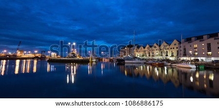 Panorama of Galway city harbour docklands illuminated at night