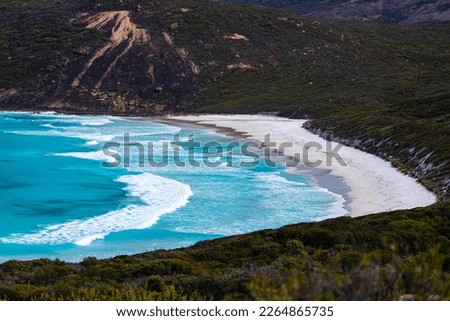 panorama of hellfire bay in cape le grand national park, a paradisiacal beach with white sand and turquoise water surrounded by mighty hills	