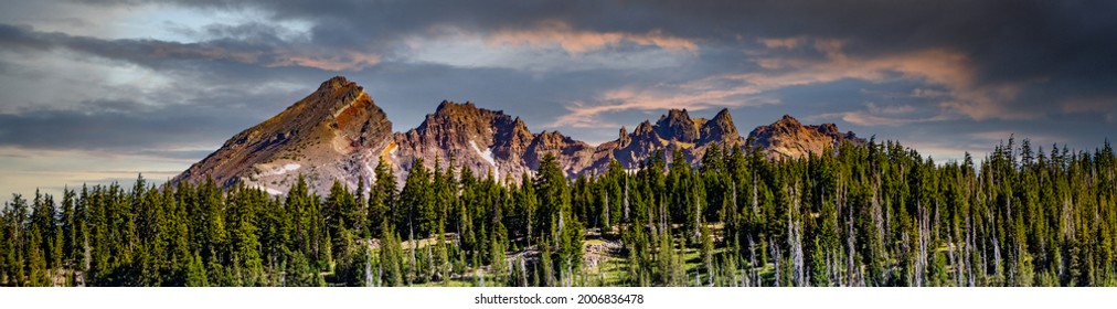 A Panorama Image Of Broken Top Mountain As It Looms Above Todd Lake In The Late Afternoon On A Hot Summer Day, On Century Drive Near Bend Oregon