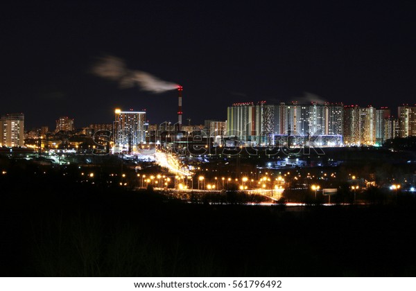 Panorama of\
industrial district of the city at\
night.