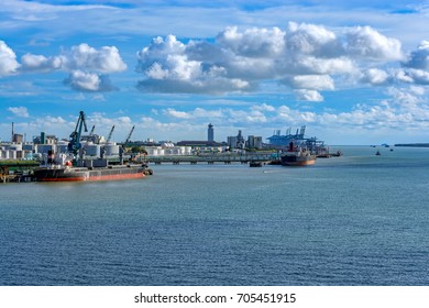 Panorama of industrial port in Klang with dry bulk terminal, container terminal and oil product tank farm. - Powered by Shutterstock