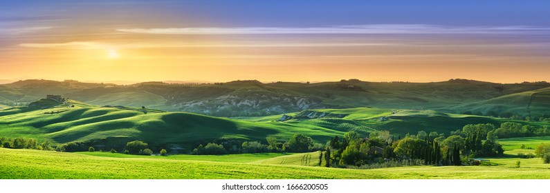 Panorama, Italian beautiful landscape, green rolling Tuscan fields in warm light of the setting sun - Powered by Shutterstock