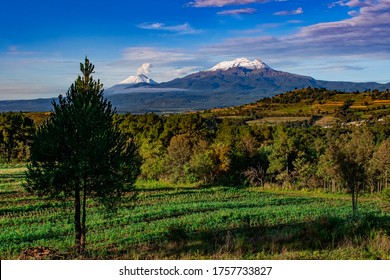 Panorama Of The Iztaccihuatl And Popocatépetl Volcanoes In The Morning, Seen From The Town Of Moxolahuac, In Tlahuapan, In The State Of Puebla, Mexico