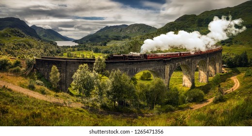 Panorama Of Jacobite Steam Train On Old Bridge, Scotland