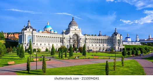 Panorama of Kazan in summer, Tatarstan, Russia. Scenic view of beautiful Farmers Palace (Ministry of Environment and Agriculture), garden and park near Kazan Kremlin. Urban landscaping of Kazan city