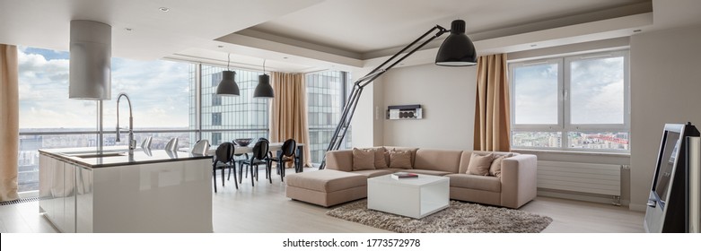 Panorama of kitchen and dining area open to living room in amazingly designed apartment with city view - Shutterstock ID 1773572978