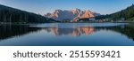 Panorama of Lake Misurina in the morning sunrise time with Alpenglow on mountain peaks, Dolomites, Italy