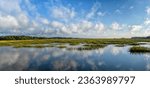 A panorama landscape of tidal beds and marshlands in Pawleys Island in South Carolina