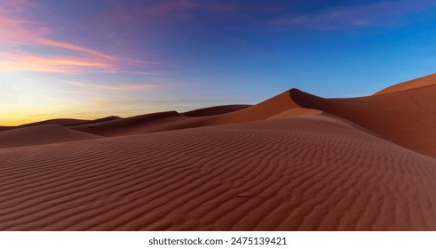 panorama landscape view of the sand dunes at Erg Chebbi in Morocco at sunset - Powered by Shutterstock