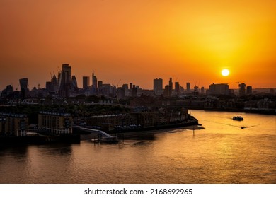 Panorama of the London skyline with river Thames during a fiery summer sunset, England