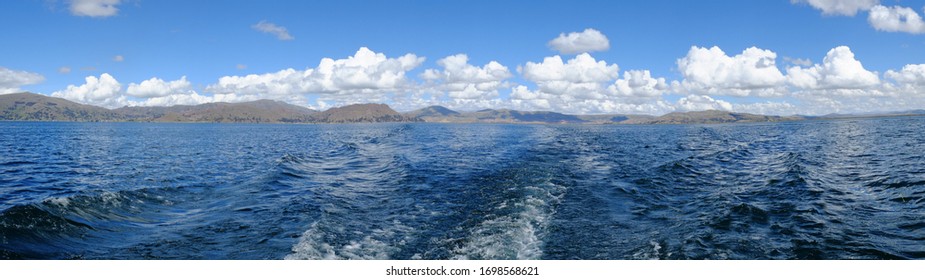 Panorama Looking At The Wake From The Boat Looking Back At Puno, On The Way To The Floating Reed Islands Of The Uros, Lake Titicaca, Peru