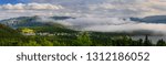 Panorama of low misty cloud a over Bonne Bay at Norris Point Newfoundland in the evening