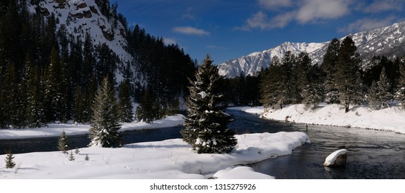 Panorama Of Madison River In Winter With Men Fly Fishing With Snowy Rocky Mountain Madison Range Montana