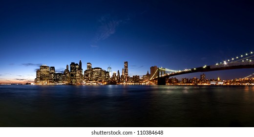 Panorama Of Manhattan Skyline At Evening After Sunset Seen From Brooklyn Bridge Park, New York City, USA