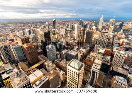 Panorama of Melbourne's city center from a high point. Australia. Beautiful panorama of skyscrapers in the city center and suburbs to the horizon. Sunset and blue clouds.