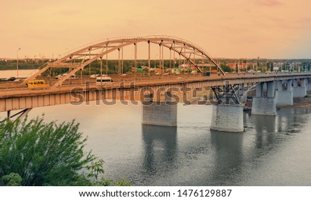 Panorama of the metallic bridge and sunset over the Belaya (White) River in Ufa, Bashkiria, Russia