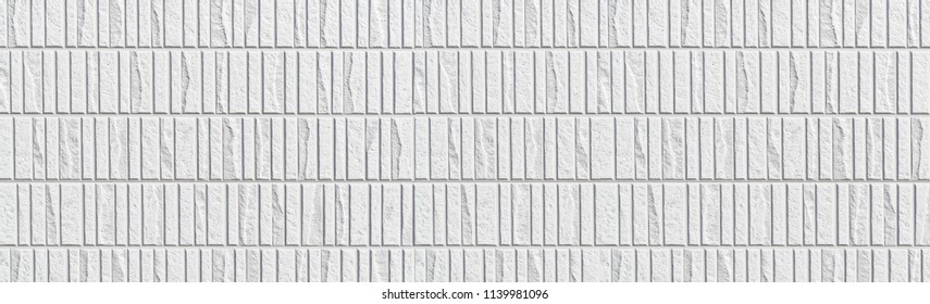 Panorama Of Modern White Stone Tile Wall Pattern And Seamless Background