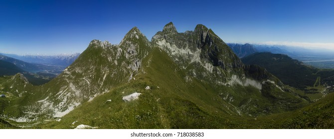 Panorama from Monte Tremol, the top of Cavallo massif (Monte Cavallo), looking at Cima Manera, Friuli Venezia Giulia plains on the right, Alpago an Santa Croce Lake on the left.