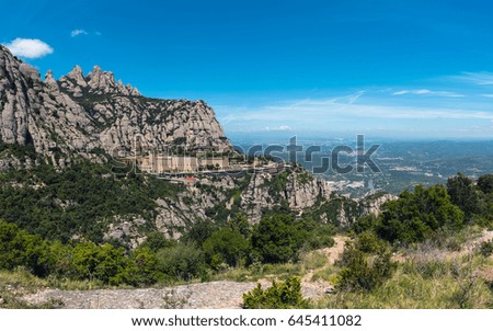 Panorama of Montserrat rocks with built monastery located near Barcelona, Spain
