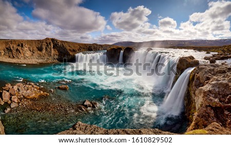 Panorama of most famous place of Golden Ring Of Iceland. Godafoss waterfall near Akureyri in the Icelandic highlands, Europe. Popular tourist attraction. Travelling concept background. Postcard.

