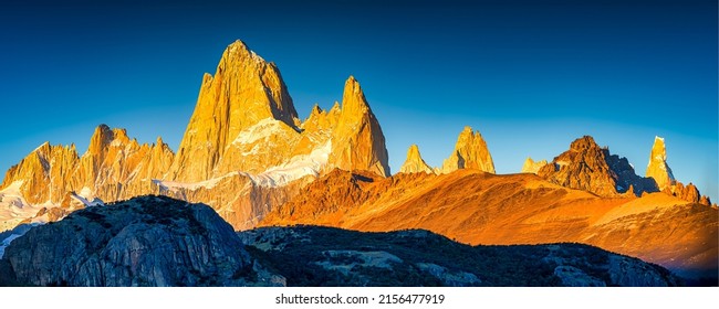 Panorama of the mountain range. Mountain range in sunlight. Mountain panoramic landscape. Beautiful mountain panorama