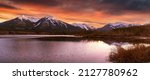 Panorama of Mountains illuminated by sunset in Banff National Park. The Vermillion Lakes are a destination for outdoor activities like paddling and seeing wildlife in the canadian rockies