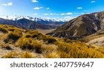 panorama of mountains in torlesse tussocklands national park, canterbury, new zealand south island; trail to trig m with panorama of alps and lake lyndon