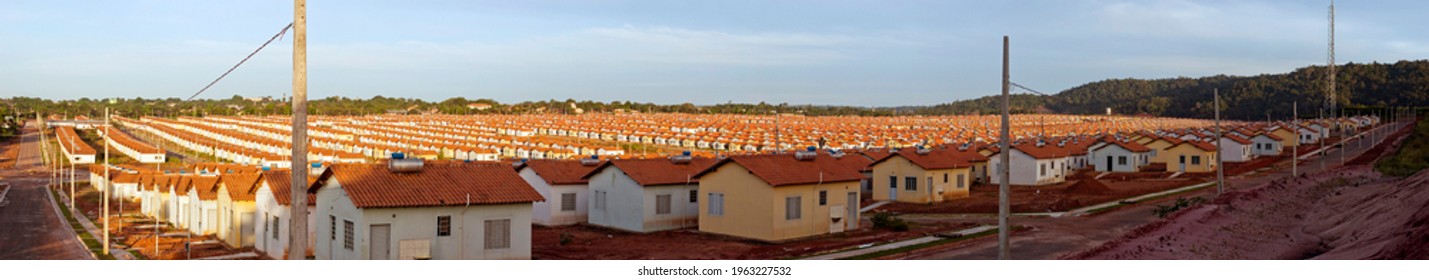 Panorama of a neighborhood with many identical popular houses built by the government housing program - Shutterstock ID 1963227532