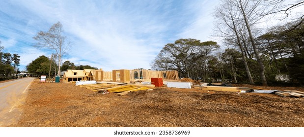 Panorama new development house OSB Oriented Strand Board plywood sheathing roofing, timber frame post beam under construction suburbs Atlanta, Georgia, USA. Suburban American residential building - Shutterstock ID 2358736969