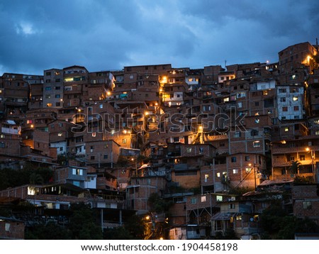 Panorama night cityscape of Juan XXIII neighborhood in San Javier Comuna 13 Medellin Colombia South America